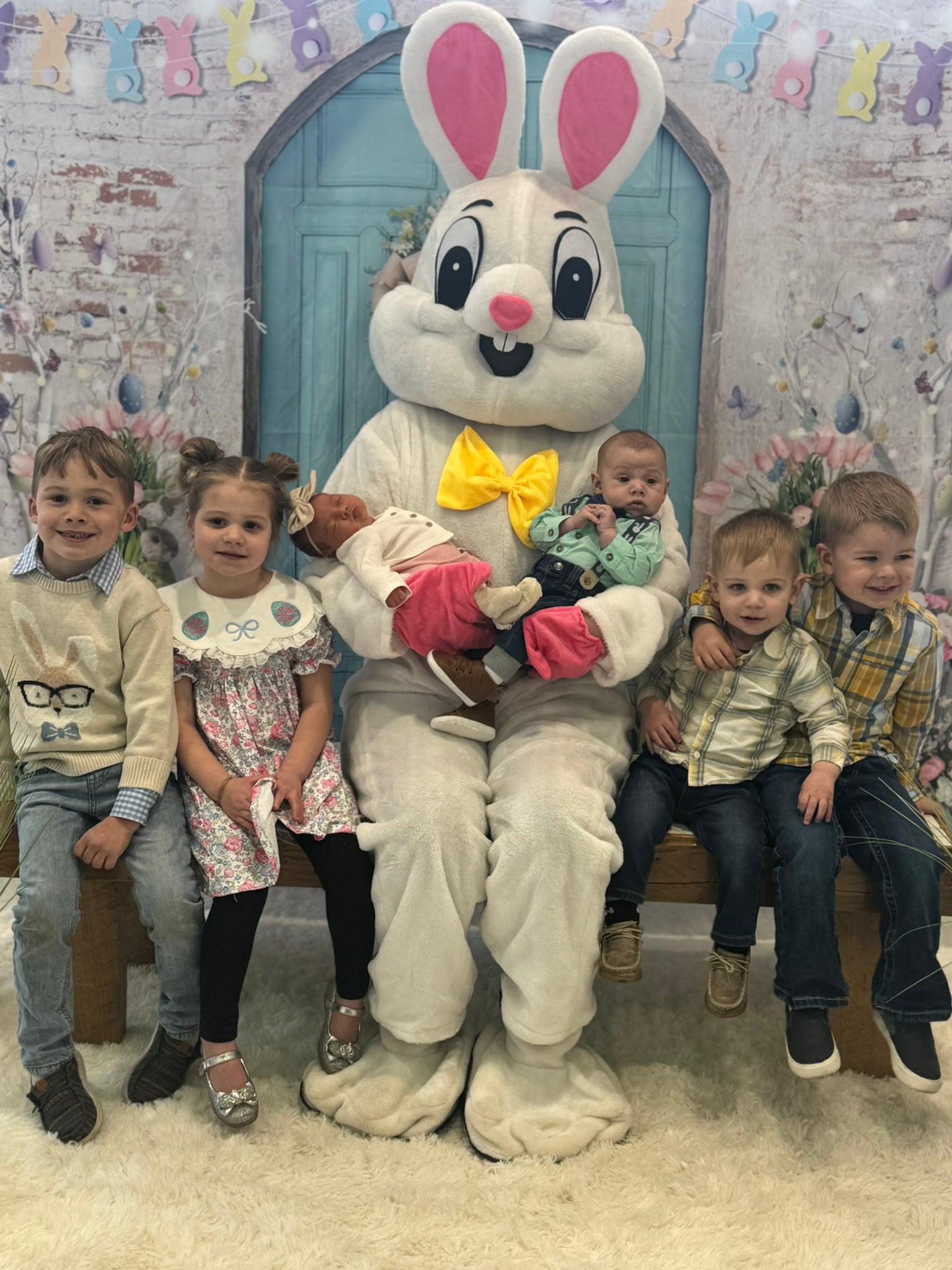 Children meeting the Easter Bunny at the annual spring event at Kemna GMC in Algona, Iowa